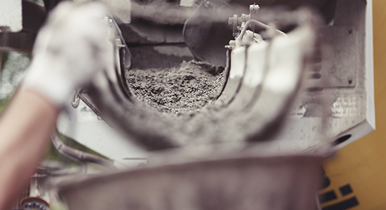 Workers pouring concrete